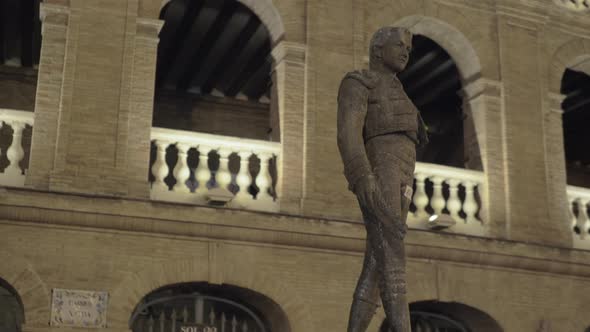 Night view of Plaza de Toros with statue of Toreador Manolo Montoliu, Valencia