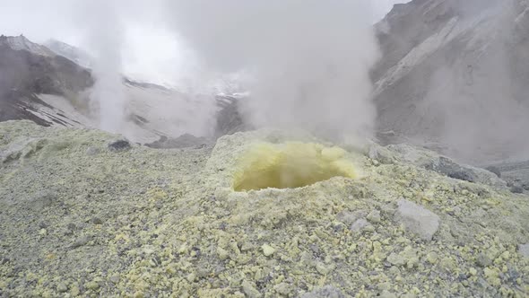 Steaming (Smoking) Fumarole on Thermal Field in Crater Active Volcano