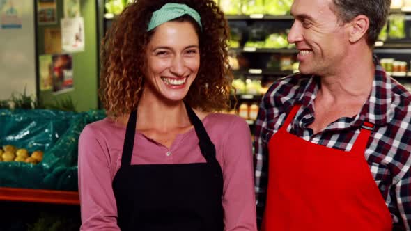 Portrait of smiling staff standing together in organic section