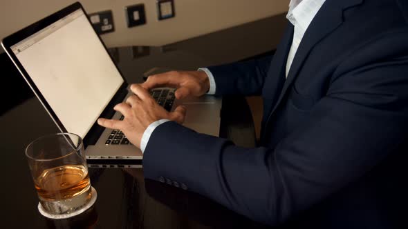 Mid section of businessman working on laptop 4k