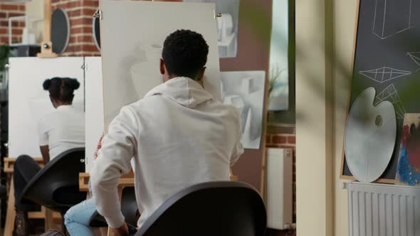 Young Man Drawing Vase Model and Taking Picture on Smartphone