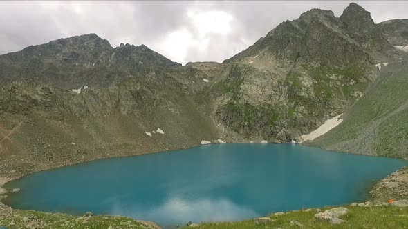 Mountain Lake With Blue Water In Rock Top 1