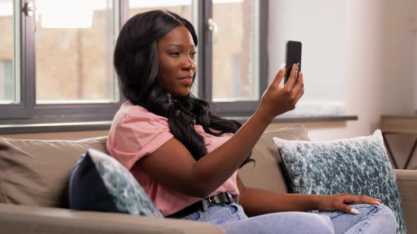 Woman with Smartphone Having Video Call at Home