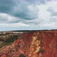 Zooming out shot by drone featuring two men on top of the cliffs - VideoHive Item for Sale