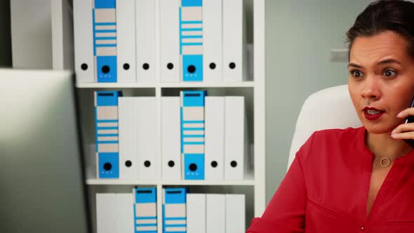 Woman Speaking on Phone During Work