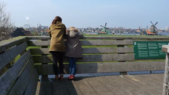 Children Looking At Wind Mills In Zaanse Schans