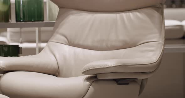 Close Up Leather modern brown armchair in living room. Modern Minimalist Home.