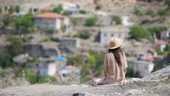 Young Woman on the Edge of Canyon in Cappodocia