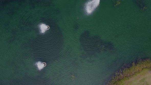 Valley Ranch lake birds eye view flying up.