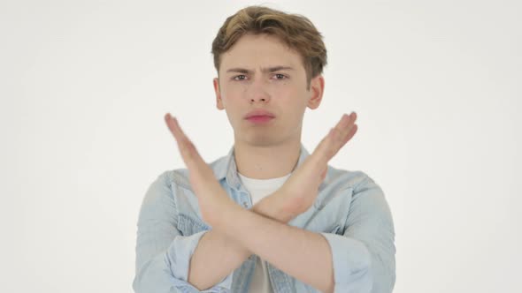 Young Man Showing No Sign By Arm Gesture on White Background