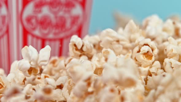 Falling Popcorn in Super Slow Motion on Blue Background