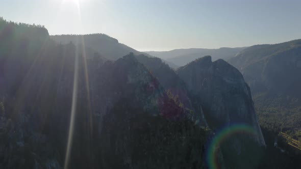 Scenic Aerial Survey Over the Yosemite National Park Lit with Bright Sunset Rays