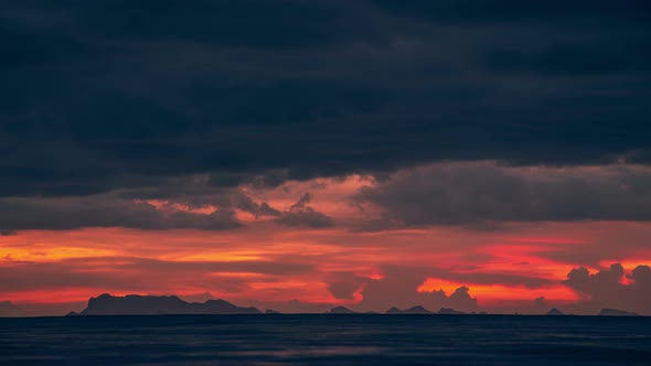 Sunset Over the Sea and Dramatic Cloudscape with a View of the Mountains Surat in Thani