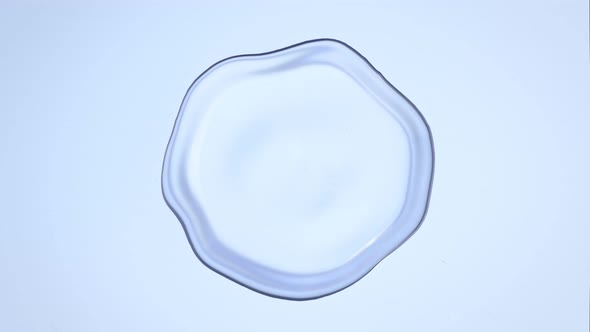 Super Slow Motion Macro Shot of Rippling Real Water Blob at 1000Fps alt