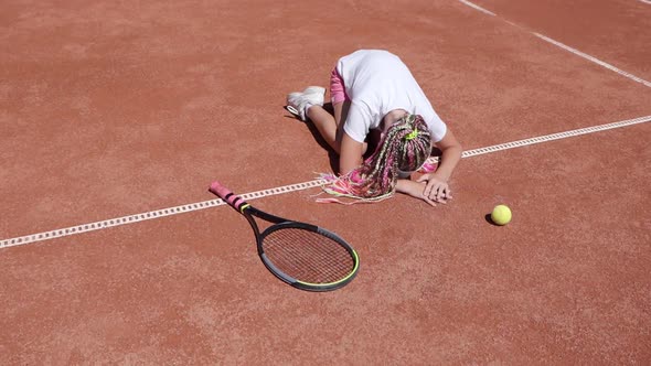 Little Girl Tennis Player Crying on the Tennis Court