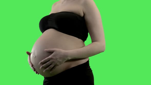 Pregnant woman stroking belly