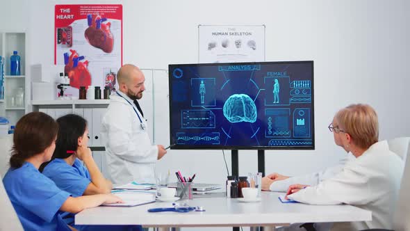 Medical Worker Presenting Report on Digital Screen About Internal Human Brain