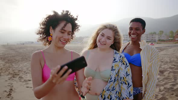 young women having fun on the beach