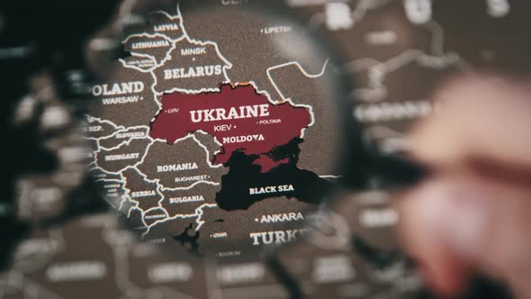 Ukraine on the World Map Under a Magnifier Loupe Worldwide Attention to War