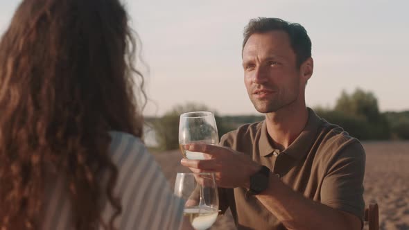 Loving Man Drinking Wine on Sunset