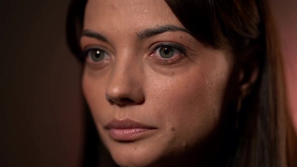 Unhappy Woman, Closeup of Face with Tears in Beautiful Green Eyes, Crying and Being Sad