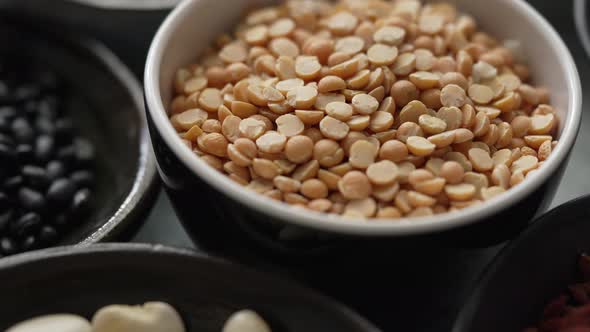 Raw Peas Halfs Seeds in Ceramic Bowl