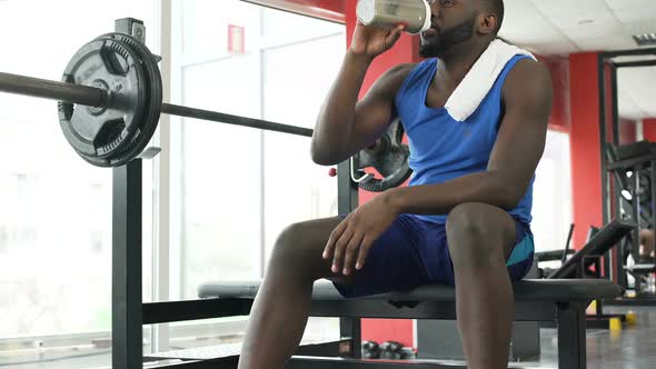 Happy Afro-American Person Sitting at the Gym and Thinking About Life, Sport