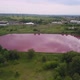 Aerial View of Artificial Lake with Pink Water, Pollution By Toxic Chemicals - VideoHive Item for Sale