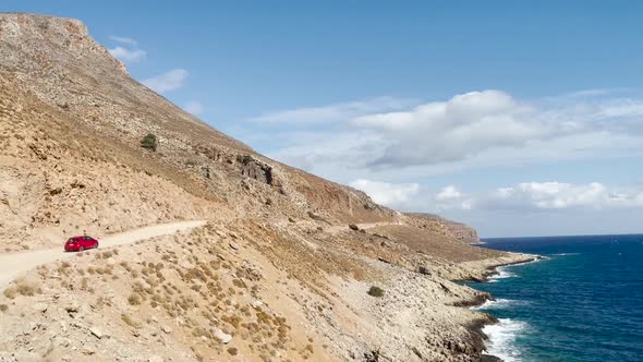 Rocky road to the iconic Balos Beach Lagoon in Crete, Greece. Sea horizon against blue sky