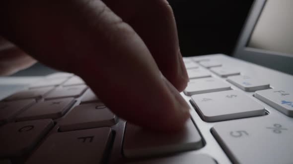 Closeup Typing on Keyboard with Man Fingers