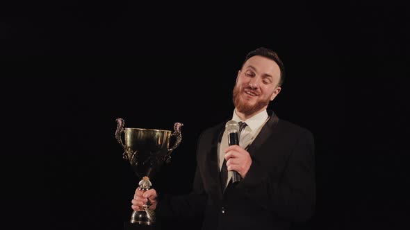 A Man is Standing on the Stage and Talking