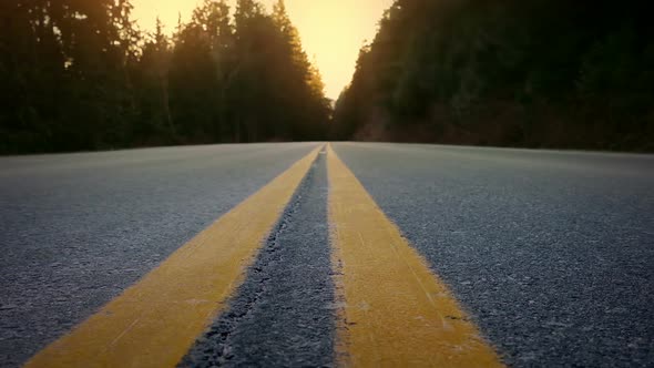 Moving Across Rural Highway At Sunset