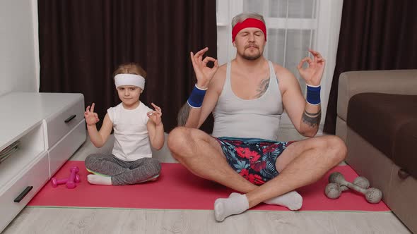 Retro Style Father and Cute Little Kid Daughter Meditating in Lotus Pose at Home Yoga Exercises