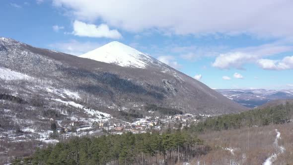 Winter scenery with Rtanj mountain peak in clouds 4K drone video