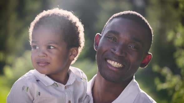 Portrait of an African Man with His Son