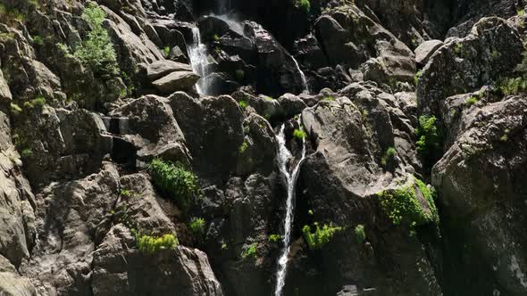 HE SPECTACULAR MEANCERA WATERFALL IN THE NORTH OF EXTREMADURA LANDSCAPED IN A NATURAL PLACEA WATERF