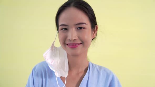 Young Asian Woman Take Off Face Mask Removing From Face