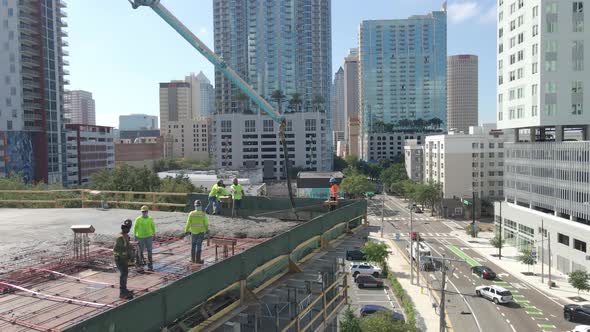 Concrete workers on a building near downtown Tampa, Florida