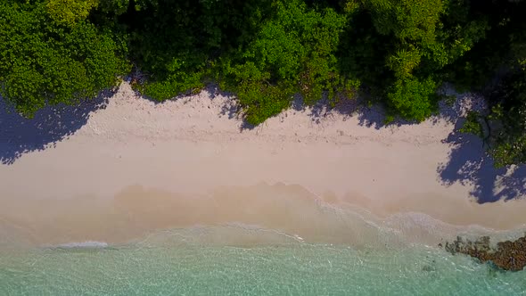 Aerial scenery of coastline beach by lagoon with sand background