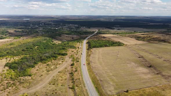 a Highway Stretching to the Horizon Among Agricultural Fields