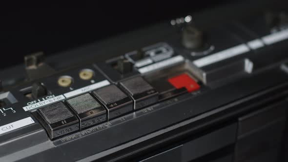 Closeup of a Finger That Presses the Stop Button on an Old Silver Shiny Cassette Recorder