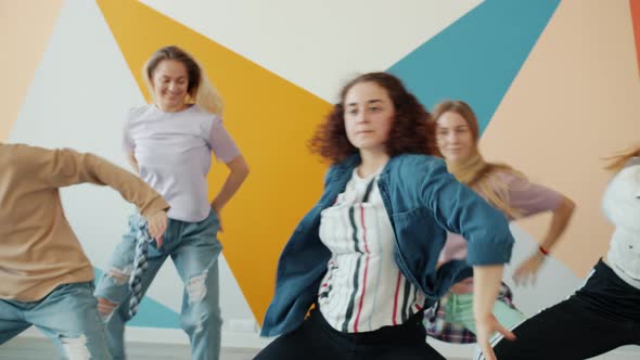 Creative Young Women Dancing in Modern Art Studio Moving Practicing Dance