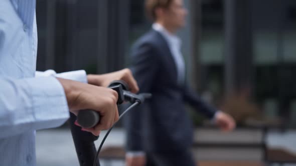 Woman Hand on Electric Scooter Close Up