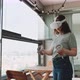 Young woman wearing vr goggles on balcony - VideoHive Item for Sale