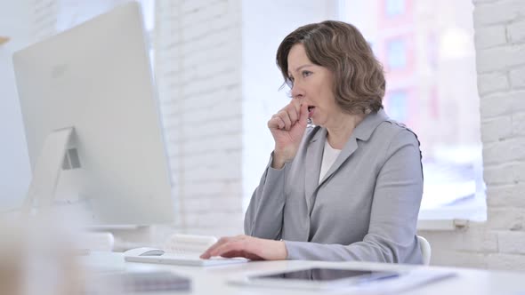 Sick Creative Old Woman Having Coughing in Office