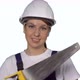 Woman Builder in Blue Overalls and White Hard Hat Helmet with Hand Saw - VideoHive Item for Sale
