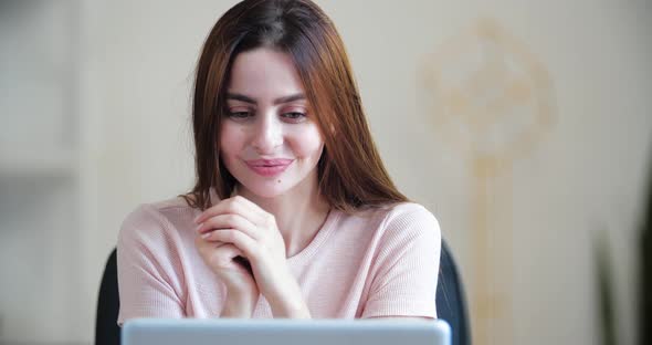 Portrait Young Woman Looks at Screen Laptop, Happy To Read Good News, Receives Letter on Email