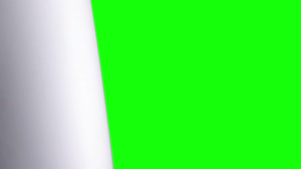 Female Hand Flips a White Sheet of Paper on a Green Screen.