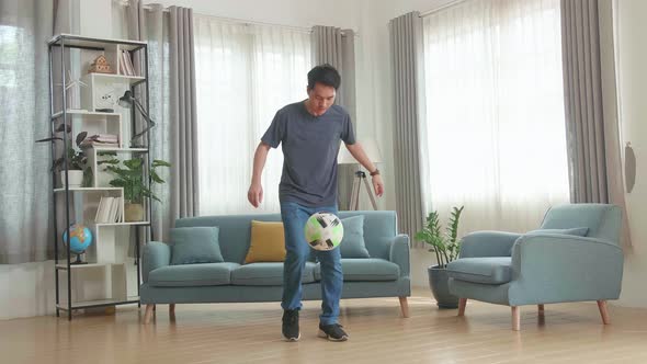 Asian Man Show Skill With Soccer Ball In Living Room, Soccer Freestyle