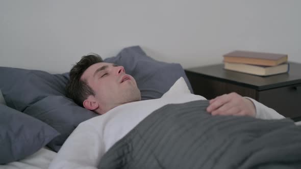 Man Sleeping in Bed Peacefully